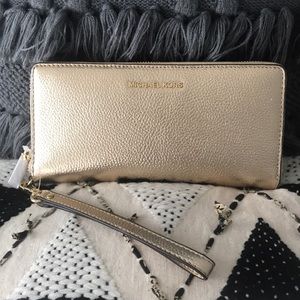 Michael Kors gold metallic wristlet/wallet